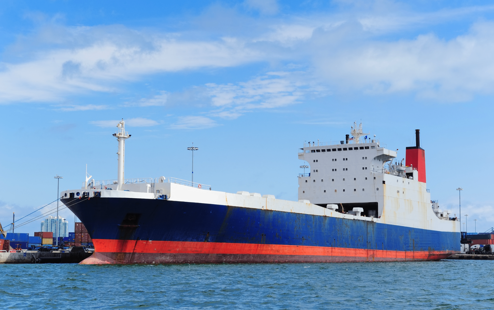 Bulk cargo vessel docked at port, steel plate imports into South Africa